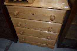 A modern pine four drawer bedroom chest