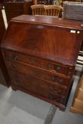 A reproduction regency mahogany bureau