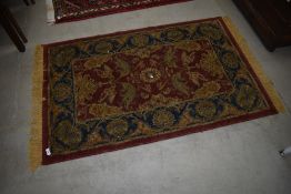 A traditional wool rug, approx 129 x 83cm