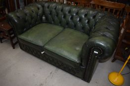 A traditional chesterfield settee in green leather, width approx. 160cm