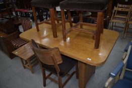 An Art Deco design drawer leaf dining table and four chairs