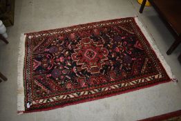 A traditional wool rug, nice bright ground , kazak or similar, approx. 125 x 82cm