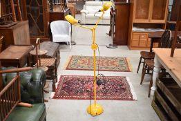 A modern double reading lamp in yellow, with that retro look