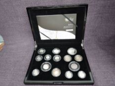 A 2011 Queen Elizabeth II The United Kingdom Silver Proof Coin Set, includes 14 Coins, 1 Penny to