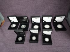 A collection of Eight United Kingdom Elizabeth II Silver Proof Coins in original boxes with