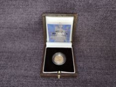 A 2001 Queen Elizabeth II 1/10 oz 10 Pound Gold Proof Britannia Coin, in original box with