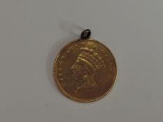 A 1856 USA Indian Prince Head Gold Dollar, large head, with small ring attached to edge