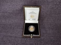 A 1997 Queen Elizabeth II 1/10 oz 10 Pound Gold Proof Britannia Coin, in original box with