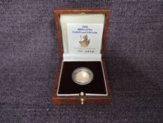 A 1996 Queen Elizabeth II 1/10 oz 10 Pound Gold Proof Britannia Coin, in original box with