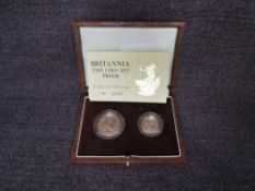 A 1989 Queen Elizabeth II Gold Britannia Two Coin Proof Set containing a 1/10 oz 10 Pound Coin and a
