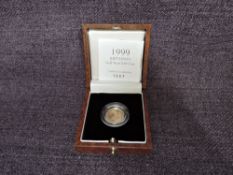 A 1999 Queen Elizabeth II 1/10 oz 10 Pound Gold Proof Britannia Coin, in original box with