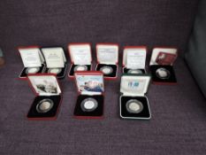 A collection of Nine Elizabeth II United Kingdom 50 Pence Silver Proof Coins in original boxes