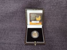 A 2005 Queen Elizabeth II 1/10 oz 10 Pound Gold Proof Britannia Coin, in original box with