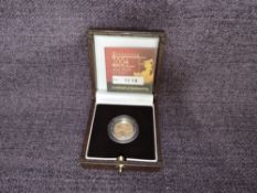 A 2004 Queen Elizabeth II 1/10 oz 10 Pound Gold Proof Britannia Coin, in original box with