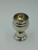 A small Danish silver egg cup in arts & crafts style bearing inscription to side dated 1925 and