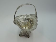A continental silver table basket stamped 800 having pierced decoration and cherubic panels, on