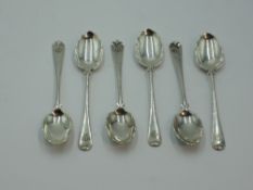 Six Victorian silver coffee spoons having monogrammed terminals and frilled and scalloped bowls,