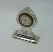 An Arts and crafts style silver clock in the shape of a pack of cards 'spade' having a Swiss