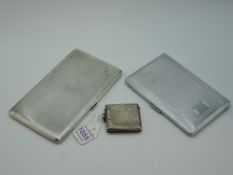 A silver cigarette case of slim rectangular form having engine turned decoration and monogram to