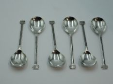A set of six silver dessert spoons having architectural design to stems and terminals, Sheffield