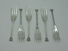 A set of six silver cake forks having stems and terminals modelled as Ionic columns, stamped