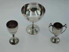 A silver champagne 'glass' of traditional plain form, London 1931, Finnigans Ltd, a small HM