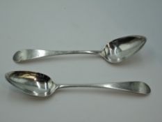 A pair of Georgian Scottish silver table spoons bearing monogram to terminals, Edinburgh 1802,