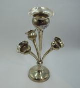 An Edwardian silver epergne having a central tulip vase within a trio of smaller similar tulip vases