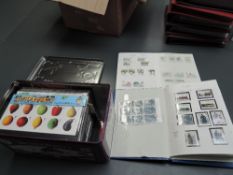 A collection of modern GB Presentation Packs and two albums containing 1970's and later GB Stamps,