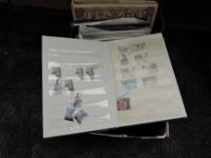 A box of World Stamps in albums, mint and used