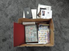 A box containing 2002 & 2007 Royal Mail Year Books, album of GB mint Stamps, Royal Mail Post