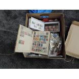 A box of World Stamps including Victory Album and Kiloware