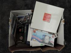 A collection of GB Mint Stamps in album and presentation packs, album & loose First Day Covers