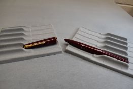 A Parker 17 fountain pen in burgundy with narrow band to the cap. Approx 13.4cm