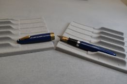 A Sheaffer Lifetime plunger fill fountain pen in blue with broad band to the cap and tuckaway