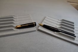 A Parker Junior fountain pen in black with narrow decorative band to the cap and having a Parker