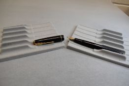A Parker Slimfold fountain pen in black with decorative narrow band to the cap, having a Parker 5