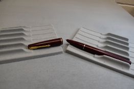 A Parker 17 fountain pen in burgundy with narrow band to the cap. Approx 13.2cm