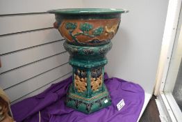 A modern Chinese sancai glazed jardiniere planter with stand approx 59cm tall having pierced