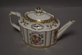 A Royal Crown Derby 'Honeysuckle' pattern teapot, of silver or commode type shape, decorated with