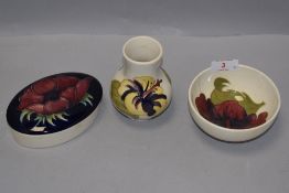 A group of three Moorcroft Pottery items, comprising baluster vase, bowl and trinket box, tube-lined