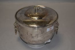 A 20th century Mappin and Webb ice bucket having lined inner with lion head handles