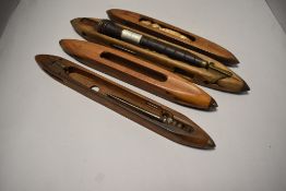 A group of four vintage loom shuttles, of traditional form
