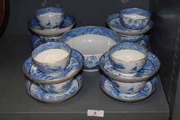 A set of eight late 19th century blue and white wear porcelain tea bowls and saucers with slop bowl