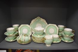 A 1920's art deco era part tea service by Paragon in a mottled green and gilt band design