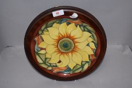 A Moorcroft Pottery 'Inca' pattern charger, designed by Rachel Bishop and tube lined with a