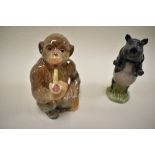 A Beswick figure study of a pipe smoking monkey no. 1049 and similar pig