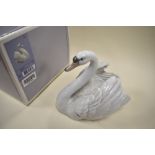 A Lladro swan with wings spread,with box.