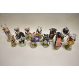 A complete set of Beswick pigs promenade figures including two limited edition figures produced