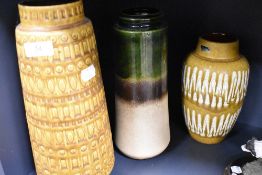 A group of three West German glazed pottery vases, one bearing label 'Schewuck'